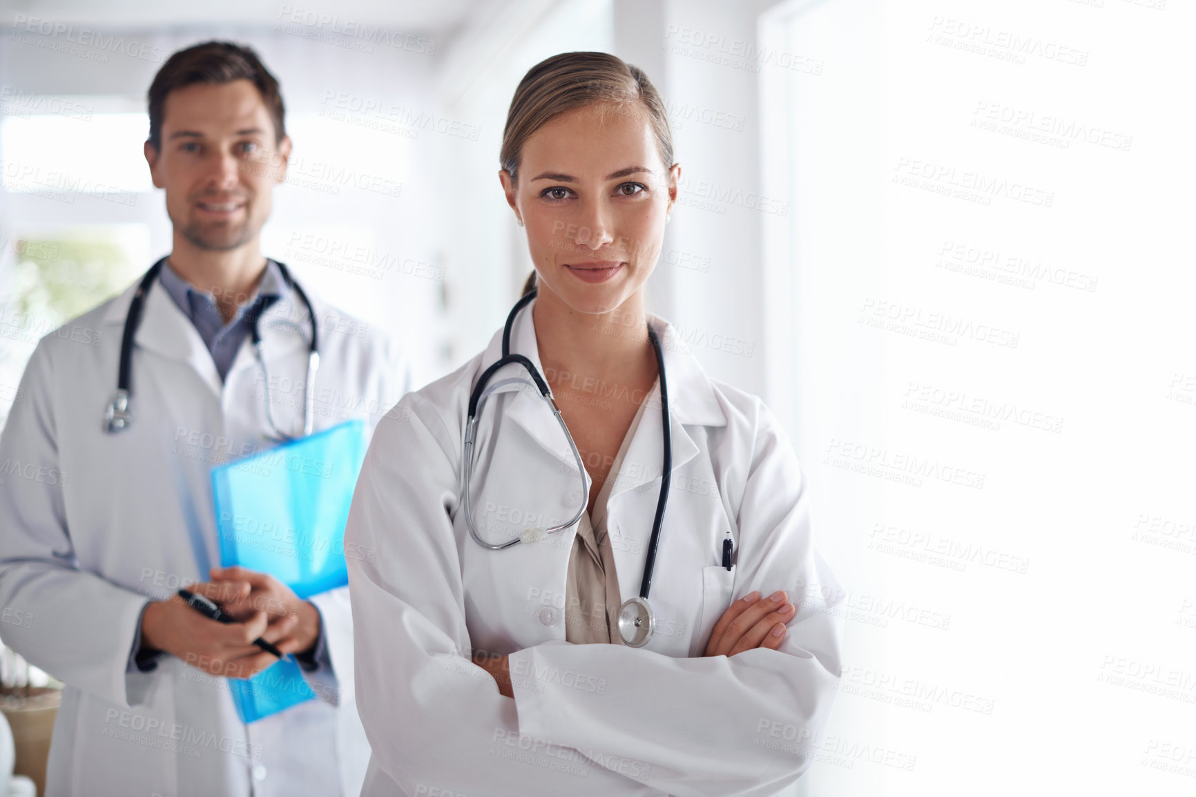 Buy stock photo Portrait of woman, arms crossed and team of doctors in hospital for healthcare, management and clinic services. Medical employees, surgery manager and collaboration for support, trust and checkup