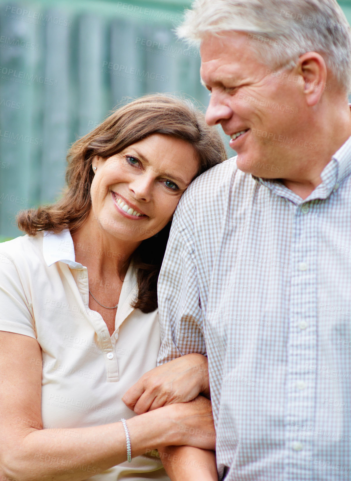 Buy stock photo Senior couple, embrace and love with commitment in marriage, care and safe and security. France, mature man and woman with satisfaction on face, hug and happy together by outdoor in gratitude