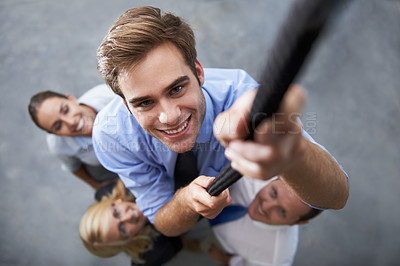 Buy stock photo Corporate people, happy man and climbing rope for goals, target or team building exercise with staff support. Top view, group mission and portrait person with hard work, determination and ambition