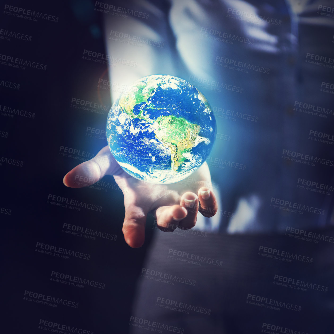 Buy stock photo Shot of a businesswoman holding the earth in her palm