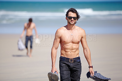 Buy stock photo Portrait, sunglasses and the body of a man on the beach for travel, freedom or adventure on vacation. Summer, sand and a young person shirtless by the ocean or sea on a tropical coast for holiday