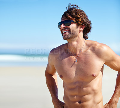 Buy stock photo Man, muscular torso and smile on beach for tan, outdoor recreation and vacation for summer trip and travel. Young person or male tourist and shirtless for happy or enjoyment in sun on holiday break