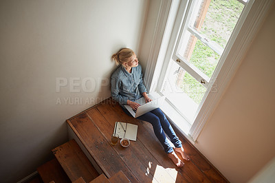 Buy stock photo Woman, freelancer and laptop by window, remote work and internet connection on floor for info. Female person, editor and website for research or online news, top view and typing an article on tech