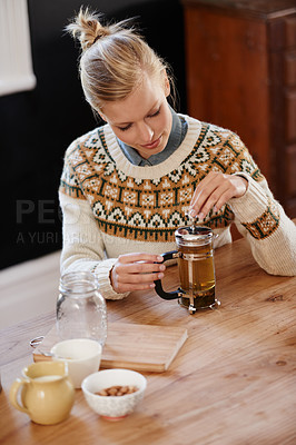 Buy stock photo Woman, happy and herbal tea for calm in home and warm beverage of herbs mixture for health. Kitchen, person and detox with dry leaves in plunger and chamomile drink to relax in apartment in above