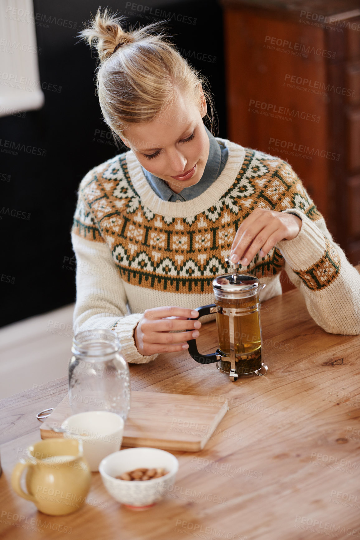 Buy stock photo Woman, happy and herbal tea for calm in home and warm beverage of herbs mixture for health. Kitchen, person and detox with dry leaves in plunger and chamomile drink to relax in apartment in above