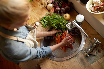Buy stock photo Person, sink and cleaning carrot in kitchen, health and hygiene with cooking food and top view. Vegetables, nutrition and organic for dinner meal, vegan or vegetarian with chef washing produce