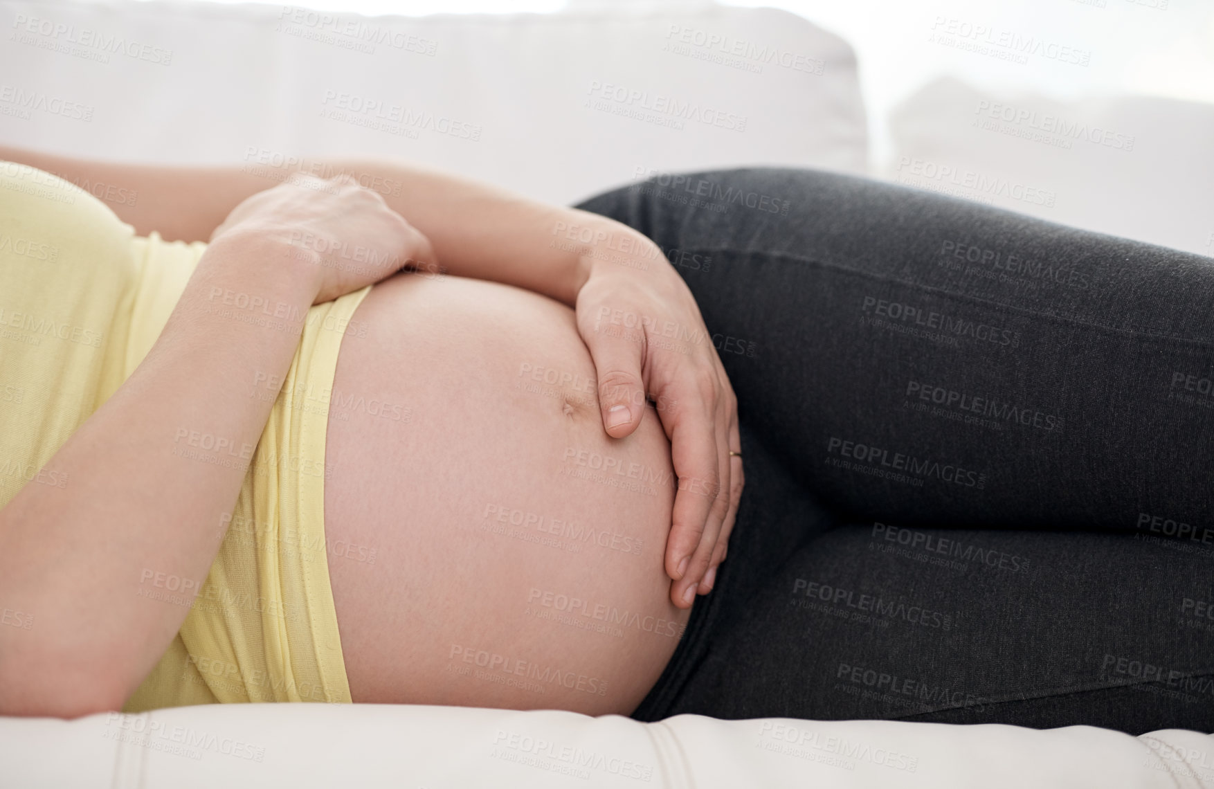 Buy stock photo Relax, belly and pregnant woman on sofa in home for bonding, rest and prenatal connection. Health, wellness and female person holding pregnancy stomach for maternity break in living room at house.