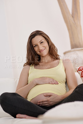 Buy stock photo Portraitof a young pregnant woman in her living room