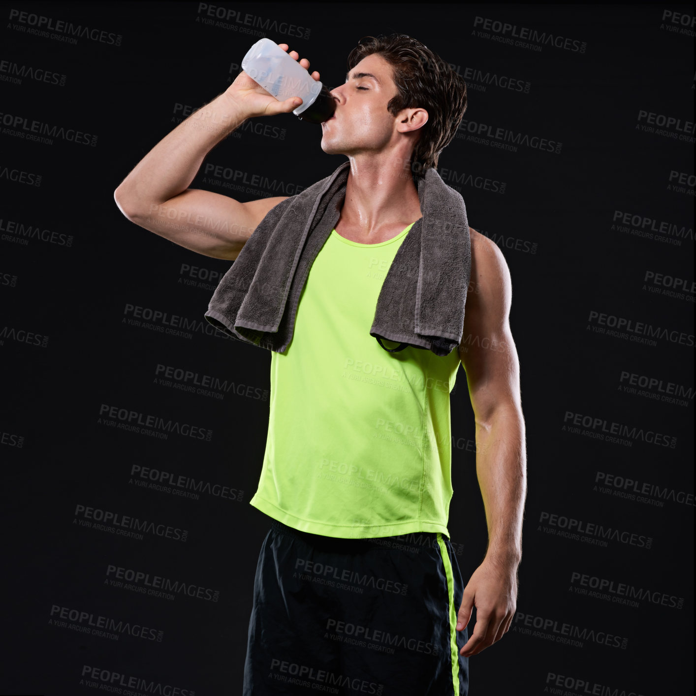 Buy stock photo Fitness, man and drinking water in studio with towel for sweat, workout and hydrate for wellness. Exercise, health and athlete by black background for muscles and liquid for weight loss or body care 