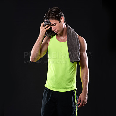 Buy stock photo Headache, fitness and man with towel in studio for workout, exercise and athlete with stress for challenge. Wellness, health and bodybuilder with anxiety or worry for performance by black background