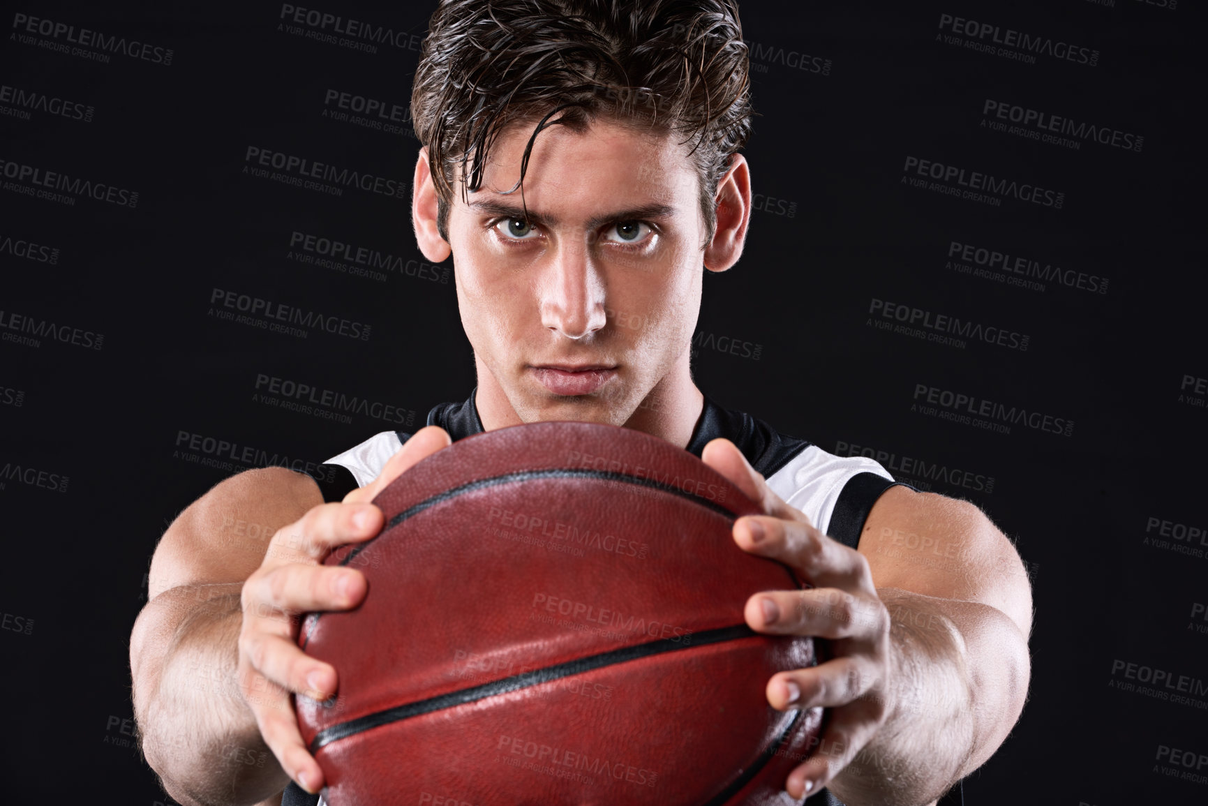 Buy stock photo Fitness, serious and man basketball player in studio with practicing, workout or training for game. Activity, portrait and athlete with sport equipment for match exercise isolated by black background