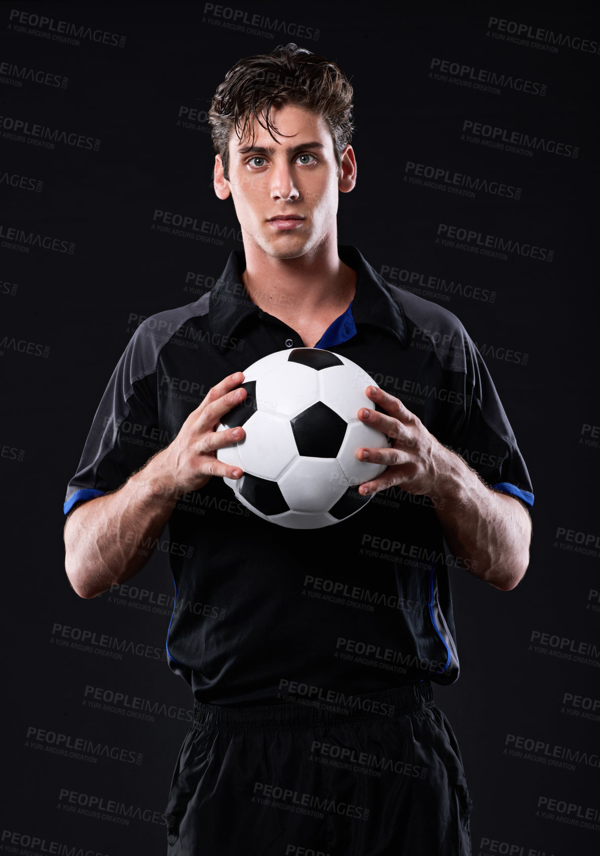 Buy stock photo Athlete, soccer ball and man in portrait for fitness, training or practice in sports as player in football. Male person, passion and game for exercise, wellness and goal on black background in studio