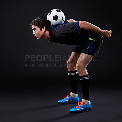 Buy stock photo Shot of a handsome soccer player isolated on black
