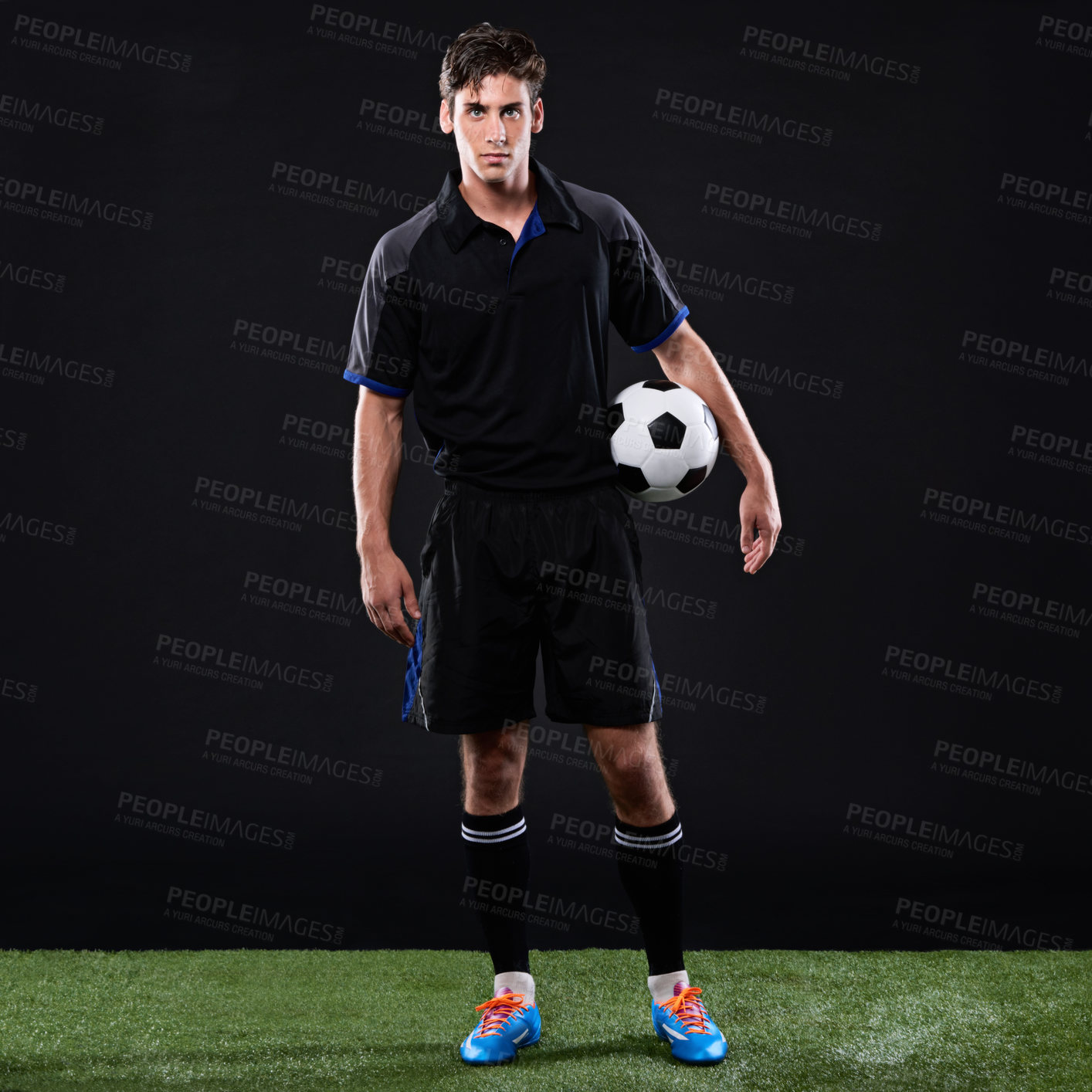 Buy stock photo Soccer, ball and portrait of man athlete on grass by black background for training, exercise or fitness. Sports, field and football player with equipment for practice, workout or match in studio.