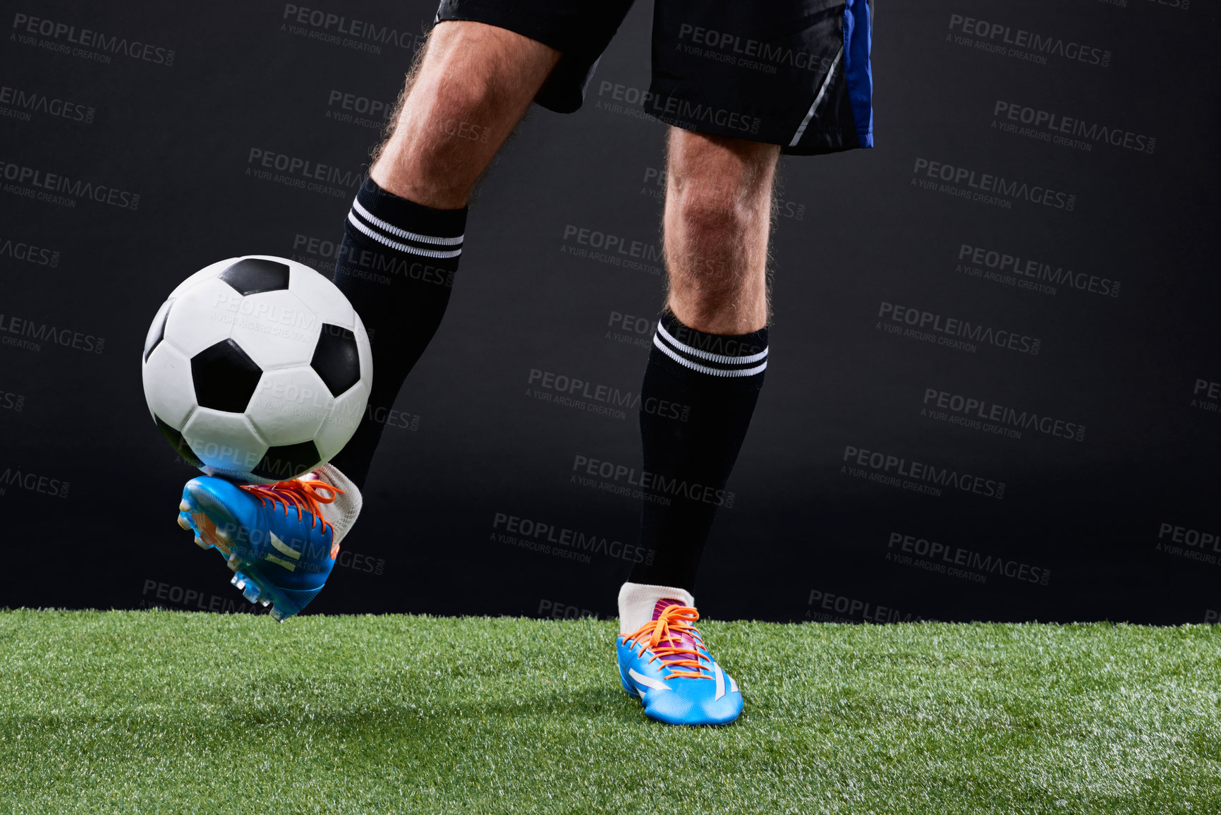 Buy stock photo Cropped shot of a soccer player playing soccer