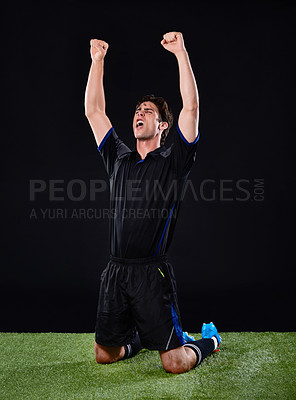 Buy stock photo Shot of a soccer player celebrating his goal