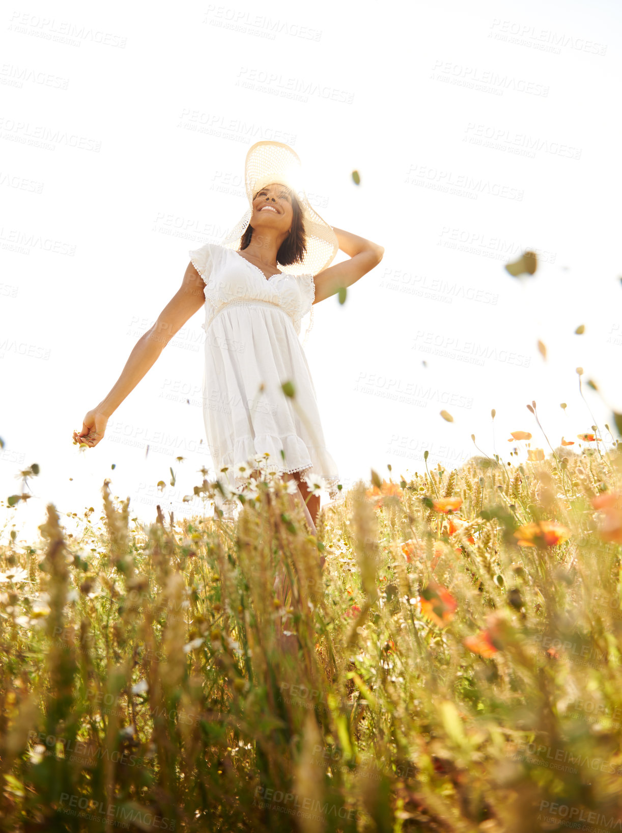 Buy stock photo Springtime, field and freedom with woman, countryside and happiness with weekend break, carefree and flowers. Person, outdoor or girl in a dress, summer and holiday with environment, grass or nature