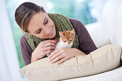 Buy stock photo Happy, pet and woman with kitten in home for bonding, friendship and relax together on sofa. Animal care, house and person with adorable, cute and young cat on couch for playing, training and love