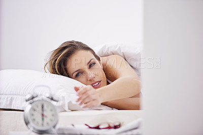 Buy stock photo Sleeping, wake up and woman in bed with alarm for snooze, morning routine and start day in home. Lazy, tired and person resting, dreaming and relaxing in bedroom with time, clock and ring in house 