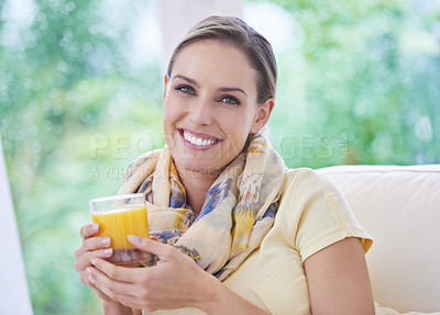 Buy stock photo Woman, smile and orange juice in glass, portrait or relax on sofa in home living room for wellness. Person, fruit punch and happy with drink for diet, nutrition or health on lounge couch in apartment