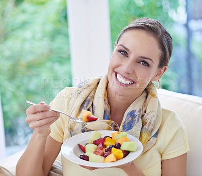 Buy stock photo Healthy food, woman in portrait with fruit salad and diet, organic product and relax on sofa with smile for weight loss. Vegan meal, gut health and wellness, eating for nutrition with vitamins