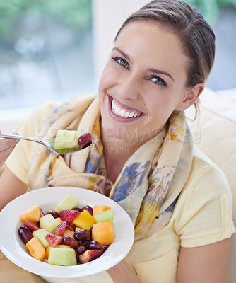 Buy stock photo Healthy food, woman in portrait with fruit in salad and diet, organic breakfast and relax on sofa with smile for weight loss. Vegan meal, gut health and wellness, eating for nutrition with vitamins