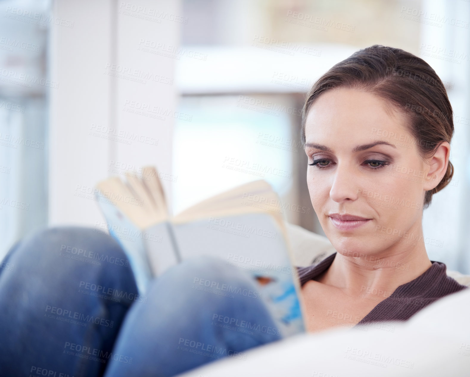 Buy stock photo Woman, book and reading on sofa to relax for story, novel and learning knowledge in living room at home. Lady, fiction books or break to enjoy literature, hobby or comfortable rest on couch in lounge