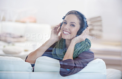 Buy stock photo Happy, portrait and woman with music headphones on a sofa streaming, listening or chilling at home. Face, smile and female person in a living room with earphones for radio, audio or playlist track