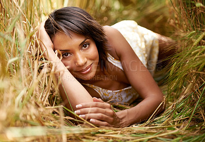 Buy stock photo Portrait, relax or happy woman lying in a field, countryside or outdoor garden for freedom on break. Smile, wellness or female person in farm for fresh air on holiday vacation or travel in nature