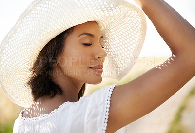 Buy stock photo Relax, summer or calm woman in a field in the countryside or outdoor garden for freedom in park or nature. Hat, wellness or female person in farm to breathe in fresh air on holiday vacation or travel