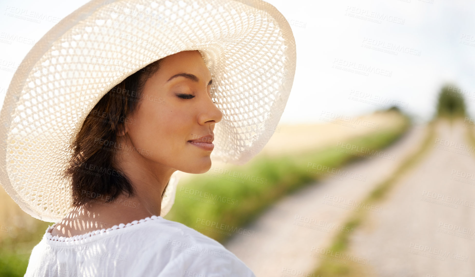 Buy stock photo Shot of a beautiful woman spending time outdoors