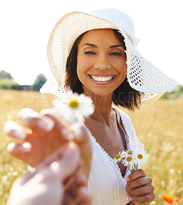 Buy stock photo Portrait, flowers or pov of happy woman in a field, countryside or nature in summer to relax on break. Hands, wellness or biracial female person in a park or farm giving a plant or gift for love