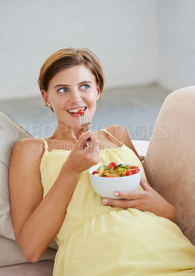 Buy stock photo Pregnant woman, salad and happy on sofa for health, nutrition and wellness in living room of apartment. Person, vegetables or smile on couch of lounge for relax, pregnancy and healthy diet with fiber