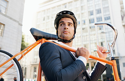Buy stock photo Businessman, holding bicycle and helmet in city for travel, commute or journey to work in Chicago. Male person, buildings and road bike for sustainability, eco friendly and mobility in morning