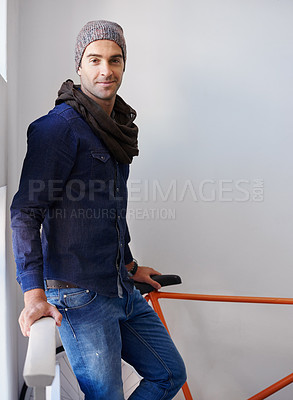 Buy stock photo Portrait, fashion and bike with man in stairs of apartment for travel, transport or commute. Home, sustainability and zero emission bicycle with confident young person on steps in winter style