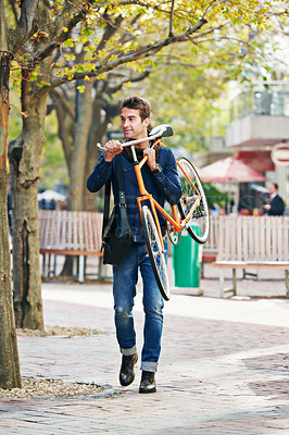 Buy stock photo Man carrying his bicycle, travel and sunshine in a city, sustainability and commute for adventure and vacation. Netherlands, person and guy with a bike and eco friendly with transportation and summer