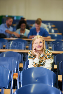 Buy stock photo University, student and happy in lecture, class and learning in hall for education. College, campus and people studying for course in school and writing notes for project, research or knowledge