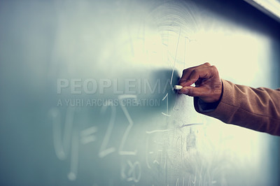 Buy stock photo Cropped image of a teacher writing a formula on a blackboard