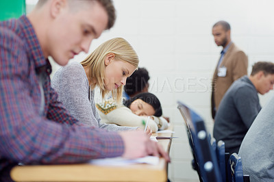 Buy stock photo University student, exam and writing or education scholarship for assessment, knowledge or lecture. People, teacher and diversity or sleeping on desk at bored class or London campus, burnout or tired