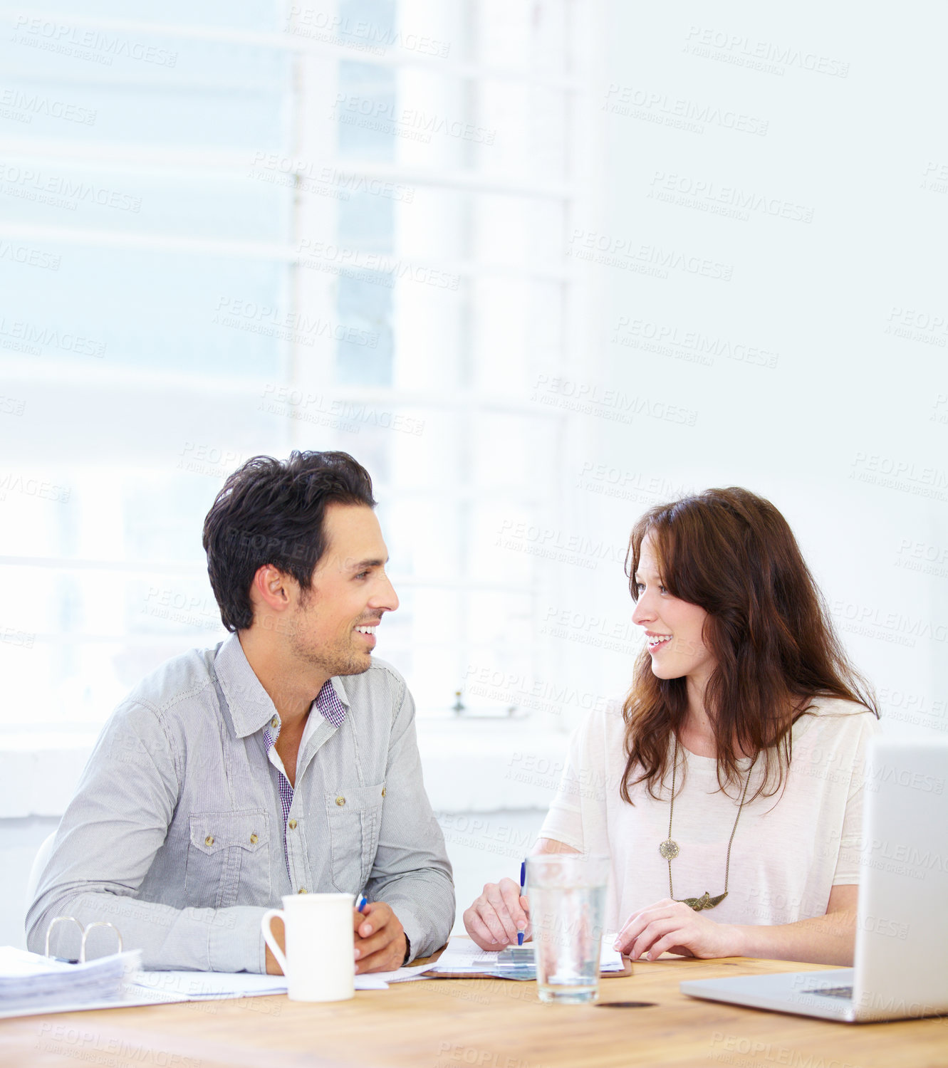 Buy stock photo Planning, meeting and business woman with partner talking, collaboration and onboarding, teamwork and b2b communication. Happy people with paperwork, documents and laptop in office for discussion