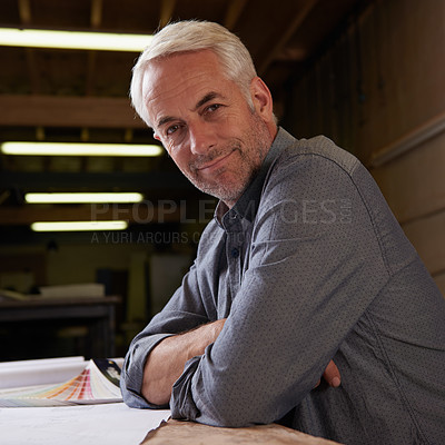 Buy stock photo Portrait, man and senior architect in workshop with smile for career in construction industry. Male person, contractor and entrepreneur of startup, small business and paperwork with design for plan