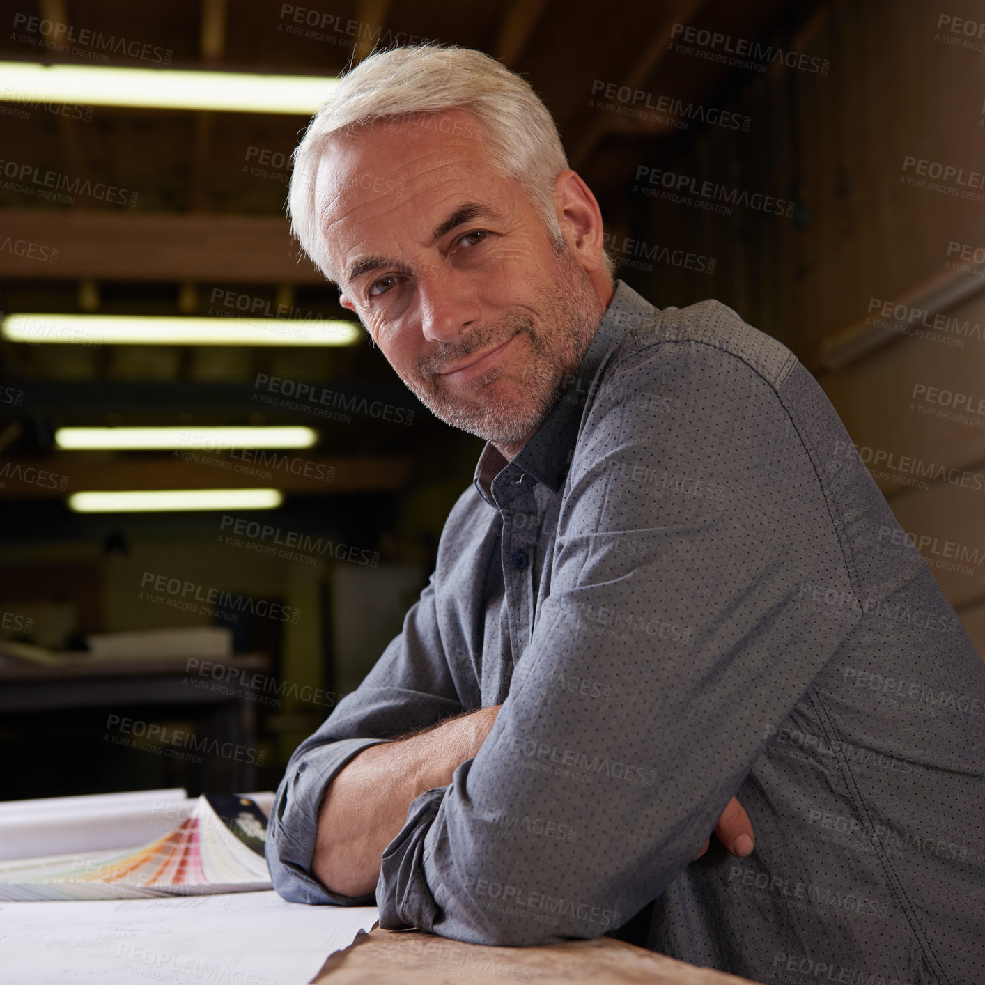 Buy stock photo Portrait, man and senior architect in workshop with smile for career in construction industry. Male person, contractor and entrepreneur of startup, small business and paperwork with design for plan