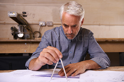 Buy stock photo Mature man, compass and architect drawing blueprint, construction and civil engineering with stationery. Drawing tools, equipment and closeup of hands with floor plan for property or renovation job