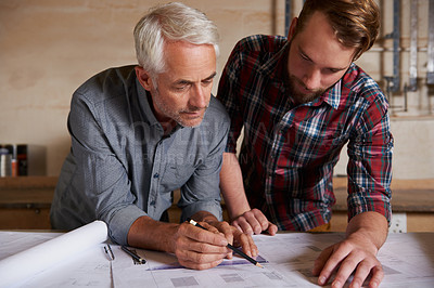 Buy stock photo Architecture team, work on blueprint in workshop with designer and engineering collaboration. Senior architect with male trainee, working on remodeling project with floor plan paperwork and drawing