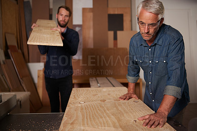 Buy stock photo Carpentry, carpenter and men in team in workshop, design project with vocation and creative DIY skill. Teamwork, collaboration and male employee with wood beam, father and son working together
