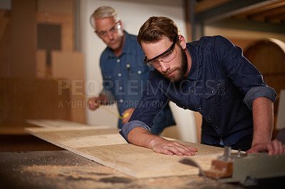 Buy stock photo Wood, father and son in a workshop, architect and carpenter with renovation or safety glasses with protection. Parent, men or teamwork with construction or building with planning for project or gear