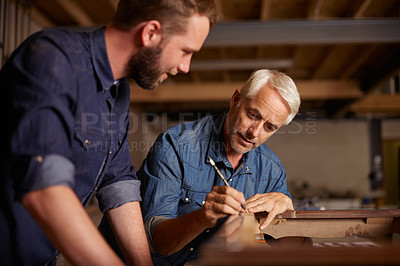 Buy stock photo Carpentry, learning and man with apprentice in training, teaching and tips for professional furniture manufacturing. Mentorship, expert carpenter and student working at wood design project workshop.