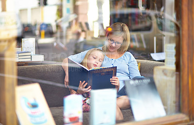 Buy stock photo Reading, books and mother with child in bookshop window with smile, learning and relax with knowledge. Storytelling, happy mom and girl in library together with story, fantasy and education in window