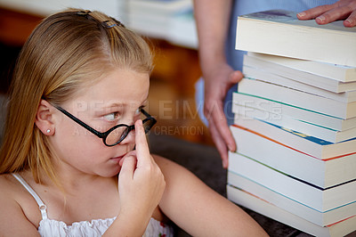 Buy stock photo Thinking, concern and a child with books at a library for education, knowledge and learning. Looking, worry and a girl, kid and librarian with textbooks for studying, hobby or homework at school