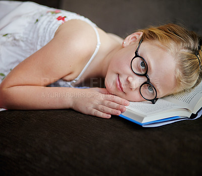 Buy stock photo Portrait, nerd and a child reading a book for learning, studying or to relax on the floor. Library, young and a girl, kid or a student at school with a novel, story or getting ready for an exam